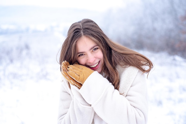 Face care in winter. Healthy face of a beautiful woman. Moisturizing. Face care and moisturizing in cold period.