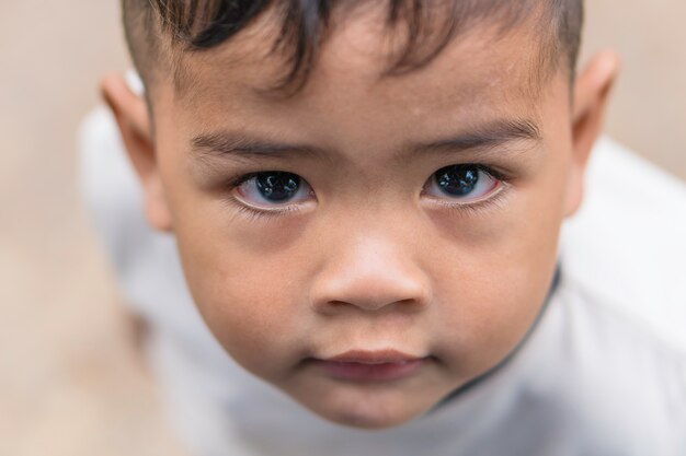 Face close up of boy mix race smiling