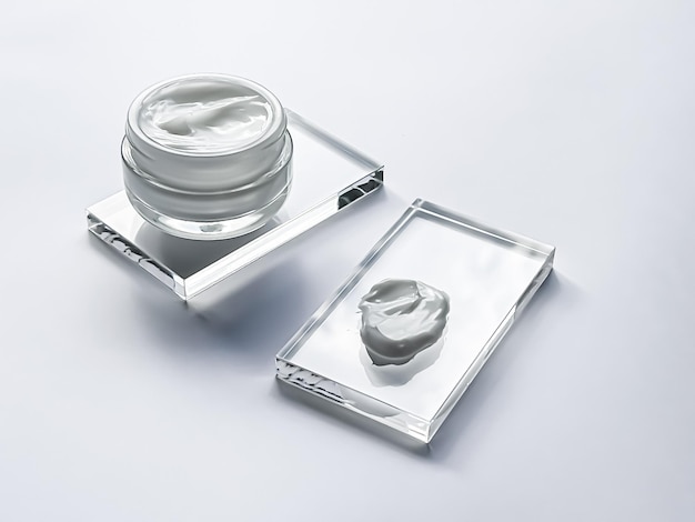 Face cream moisturiser jar and product sample on glass beauty and skincare cosmetic science