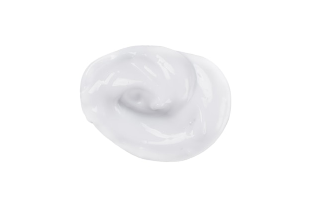 Face cream smear isolated on white background White lotion swatch Abstract cosmetic cream texture