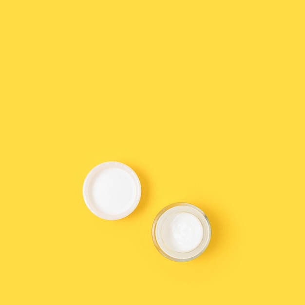 Face cream on a yellow background