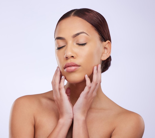 face eyes closed or girl with natural beauty or skincare in studio isolated on white background facial treatment model grooming or zen young woman relaxing with glow or luxury self care cosmetics