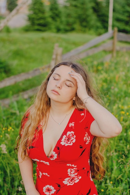 The face of a girl in a red dress