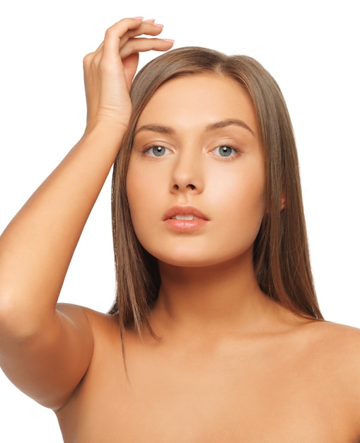 face and hands of worried woman with long hair