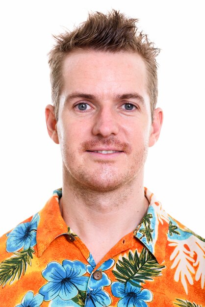 Face of happy man smiling while wearing Hawaiian shirt