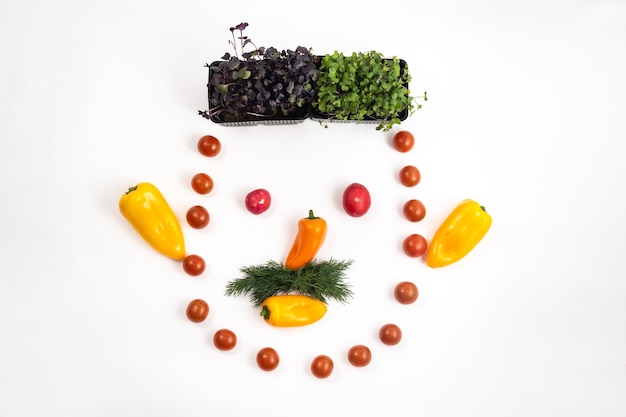 Photo the face of a man made of sliced vegetables on a white background