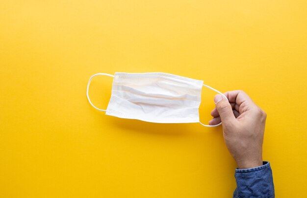 A face mask on a colorful bright background