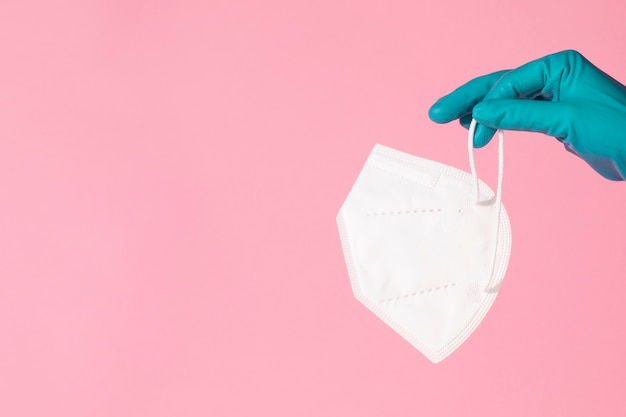 Face mask held in hand