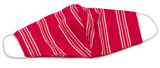 Face mask made of cloth over white background