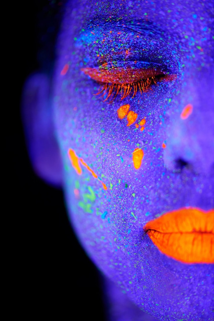 Photo face neon and psychedelic closeup for creative art and glitter with unique surreal glow person science fiction and color with dream rave and abstract uv illusion for mystical fluorescent trance