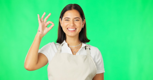 Premium Photo | Face ok hands and happy woman on green screen background  and support of small business startup Portrait of female model smile and  okay of success yes and icon of
