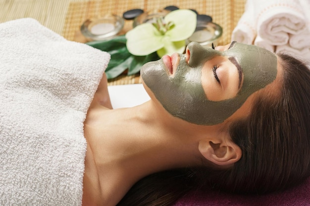 Face peeling mask spa beauty treatment skincare Woman getting facial care by beautician