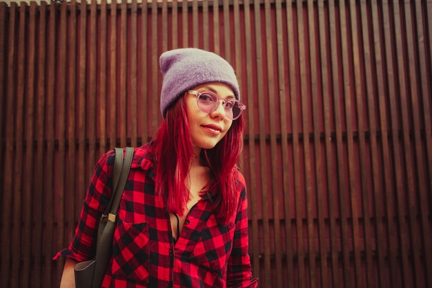 Face portrait of girl with piercing on lips outdoors. Street style, alternative lifestyle