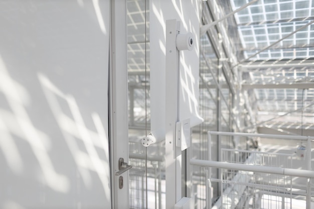 Face recognition system with camera in front of the office in white