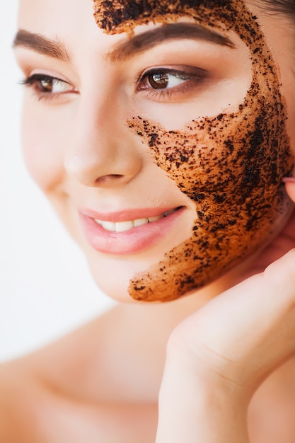 Face Skincare Young Charming Girl Makes a Black Charcoal Mask on Her Face