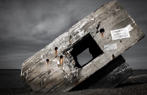 Face view of a concrete bunker from wwii on a french beach