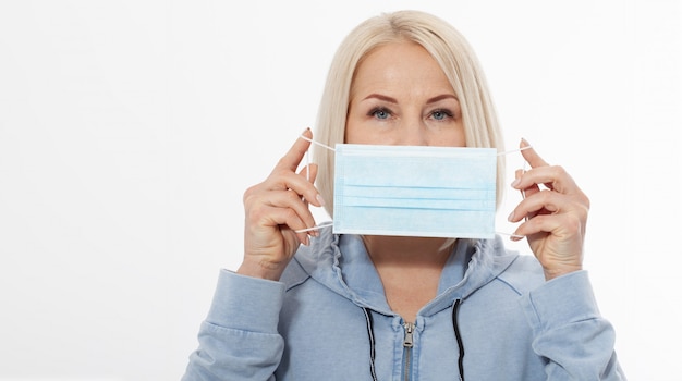 Face of a woman wearing a mask. Concept coronavirus, respiratory virus and Air pollution.