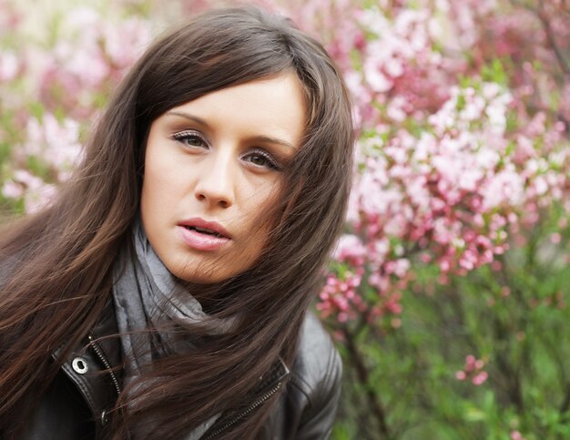 Face of the young beautiful sexy woman outdoors close up