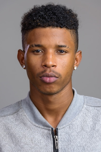 Face of young handsome African man looking at camera