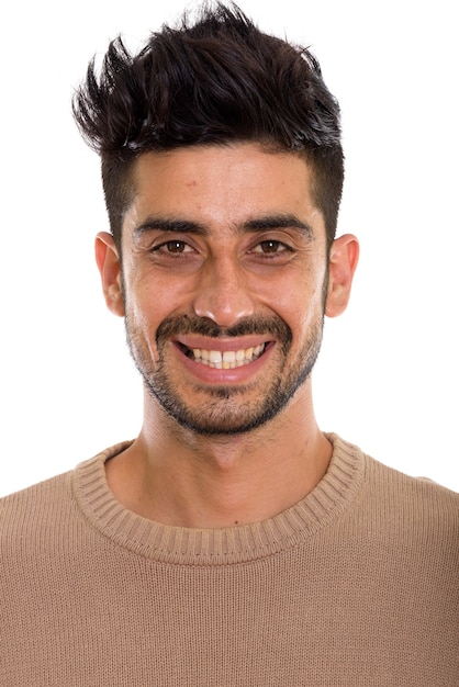 Face of young happy Persian man smiling