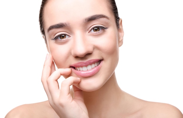 Face of young woman on white background