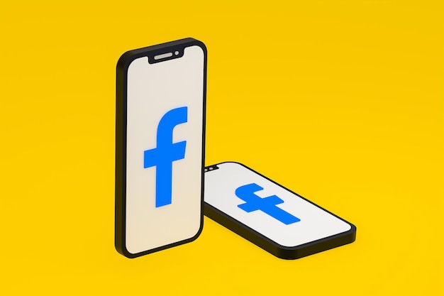 画面上のスマートフォンまたは携帯電話の3DレンダリングのFacebookアイコン