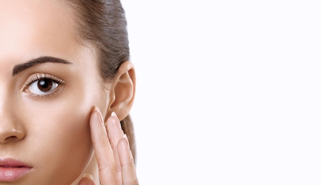 Facial Care Female Applying CreamPortrait Of Young Woman With Cosmetic Cream On Skin