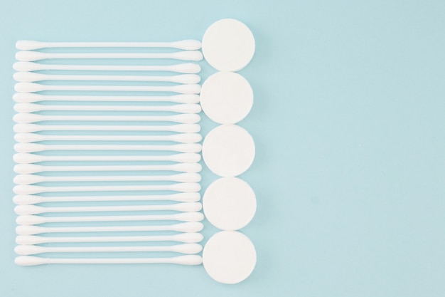 Facial mask sheets compressed type and White cotton buds  on blue background