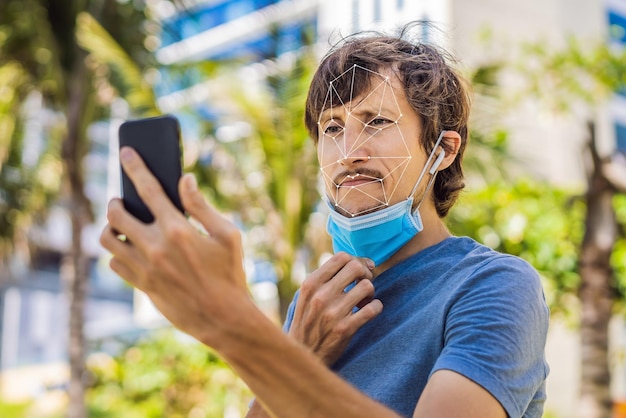 Foto riconoscimento facciale in maschera medica utilizzando intelligenza artificiale e