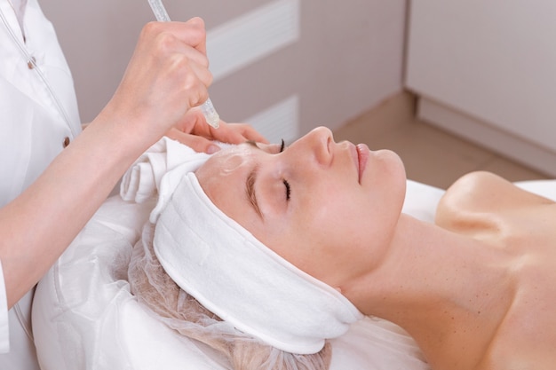 Facial treatment. Beauty face care, gas-liquid procedure for woman over 30. Skin care concept.