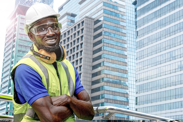 Factory engineer African man standing confidence in front of building facade