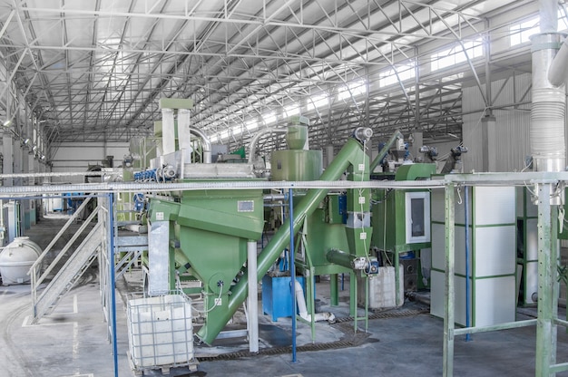 Factory equipment for processing and recycling of plastic bottles. PET recycling plant