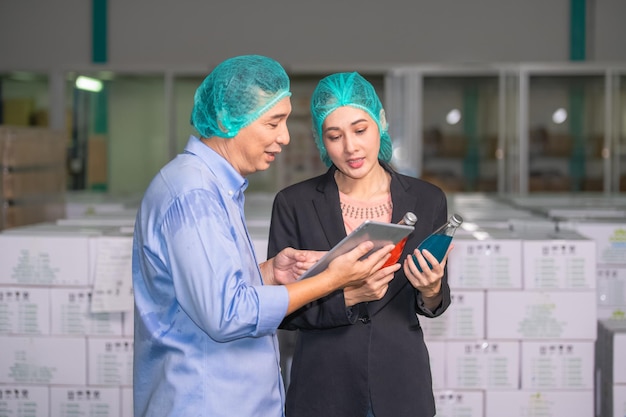 Factory manager talking with quality control team in food factory for food quality business export to customer Factory manager with worker employee checking inventory in stock Wearhouse