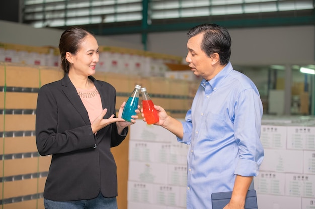 Factory manager talking with quality control team in food\
factory for food quality business export to customer factory\
manager with worker employee checking inventory in stock\
wearhouse