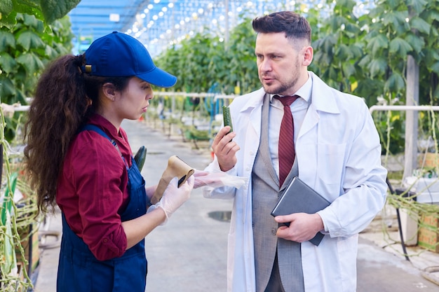 Factory worker talking to a scientist