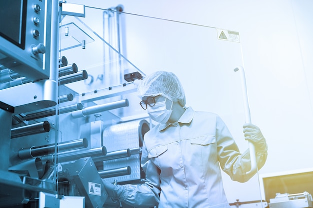 Factory worker work with machine