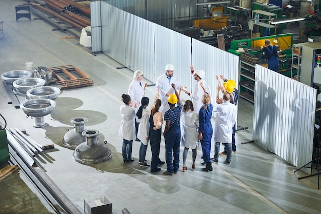 Factory Workers Meeting with Managers