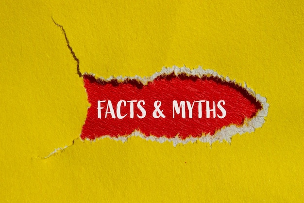 Photo facts and myths words written on ripped yellow paper with red background