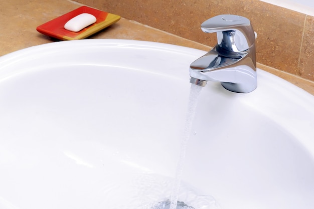 Faience sink and a piece of soap