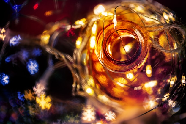 Fairy light in a glass jar.Christmas/Happy new year decoration background.