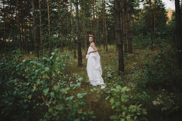 Fairy princess in a white dress in the garden