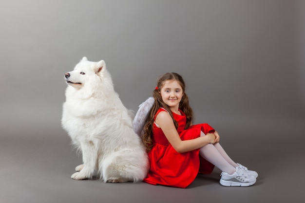 Faithful friends, a girl and a dog. Friendship symbol