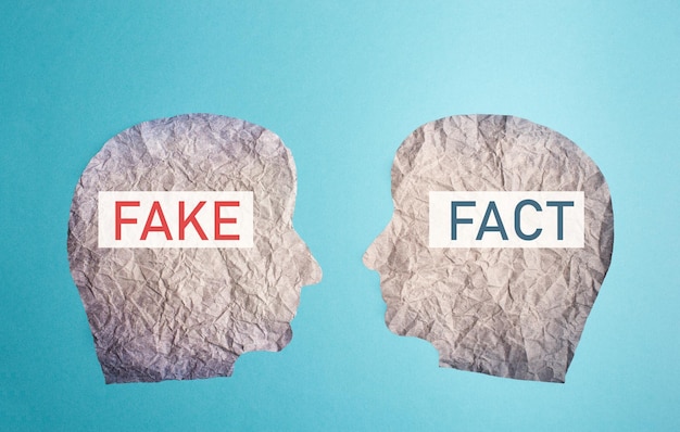 Fake or fact on a head, false and truth information, propaganda and conspiracy theory concept, media