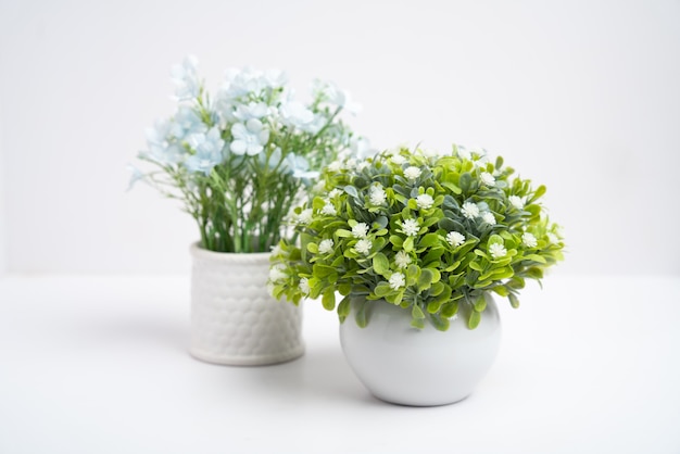 Fake flower, plastic flowers in a vase isolated