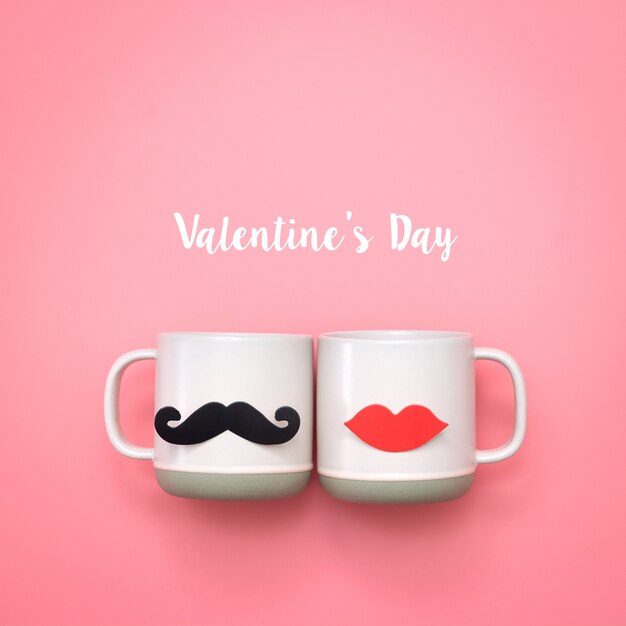 Fake lips and mustaches decoration on pink cup. valentine's day and wedding concept.