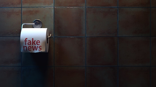 fake news inscription on toilet paper in the toilet