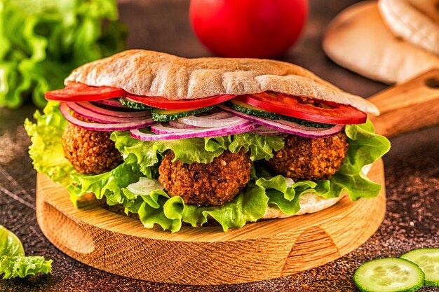 Falafel and fresh vegetables in pita bread