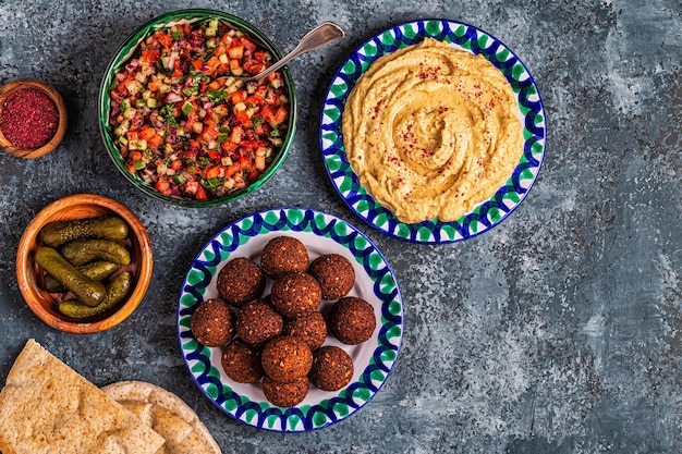 Falafel and hummus - traditional dish of Israeli and Middle Eastern cuisine, top view.