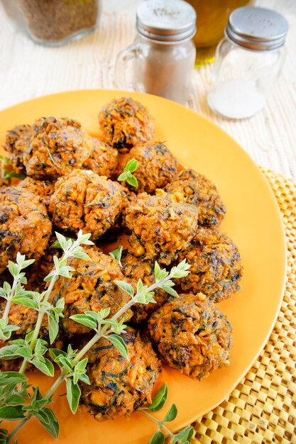 Falafel prepared with carrots and various spices