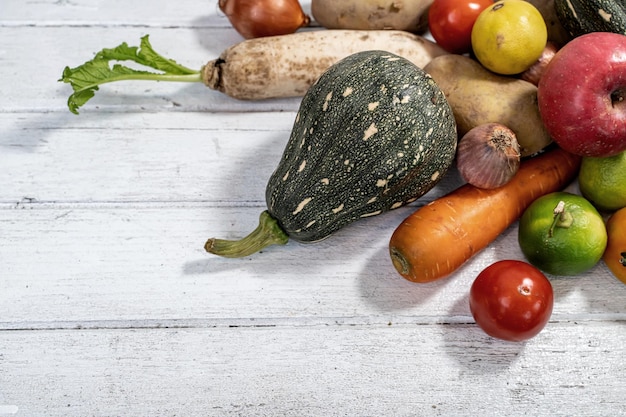 Fall harvest and Autumn season with organic fruit and vegetable on wood background